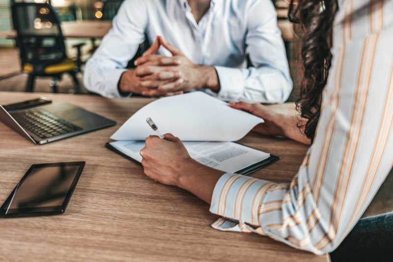 Two people negotiating on divorce papers