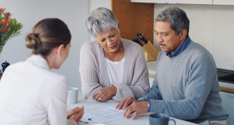 Elderly couple with an attorney discussing trust administration options