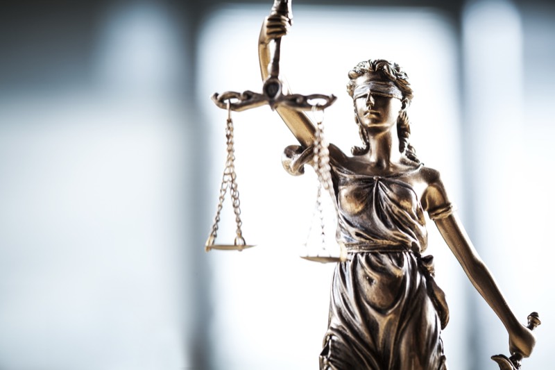 Criminal Law statue of justice holding scales