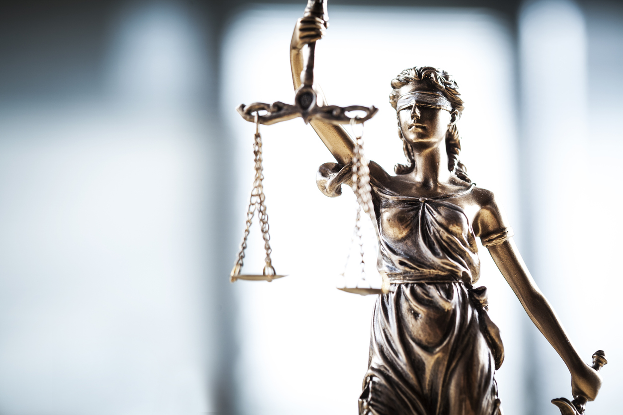 Criminal Law statue of justice holding scales